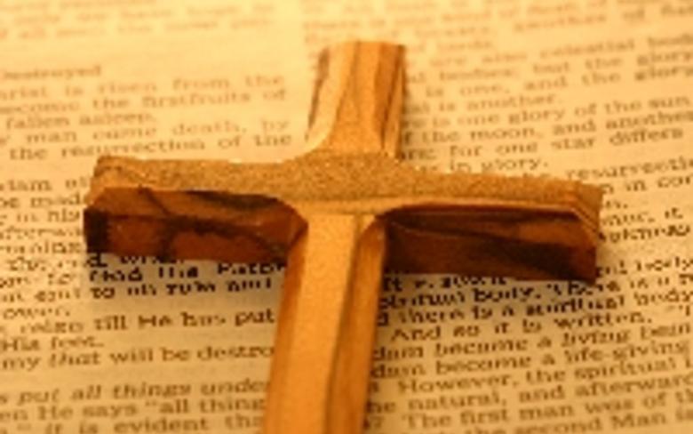 A picture depicting a cross on a Hebrew Bible